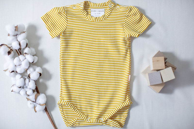 kinder capsule unisex onesie in citron - clothes that grow with your child